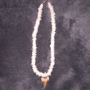 • santa cruz, calif. — puka shell shark tooth necklace